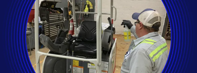 Worker disinfecting equipment during the pandemic