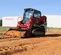 Red and black Takeuchi Compact Track Loader
