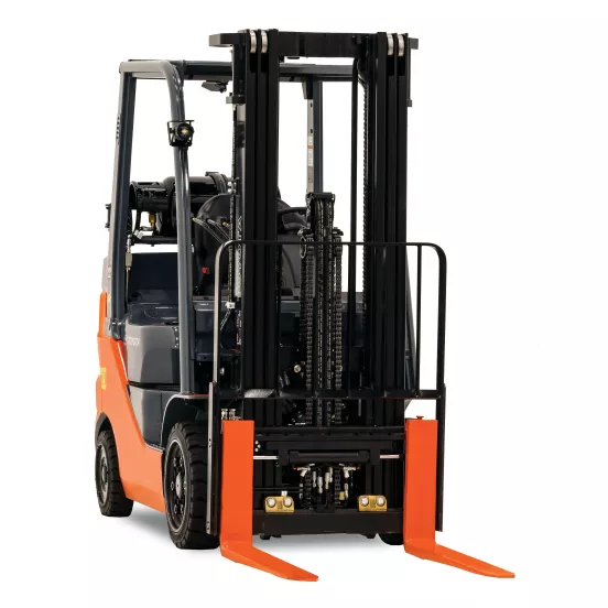 Front view of orange and black warehouse forklift with black lifting mast and orange forks with an open cabin.